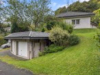 Garagen - Werz Immobilien - VERKAUFT – Einfamilienhaus mit Kamin, Terrasse und Waldrandlage.
