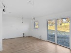 Wohnzimmer - Werz Immobilien - Bungalow mit großzügigem Wohnkonzept